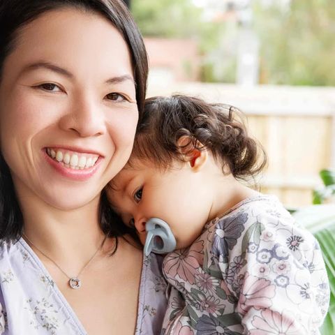 Dr Gloria with her toddler using a Minbie pacifier