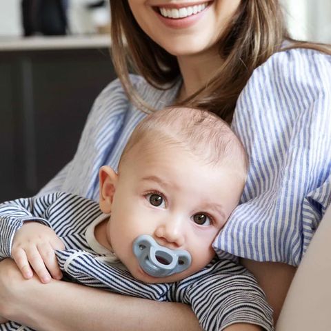 Kathryn with her baby using a Minbie pacifier